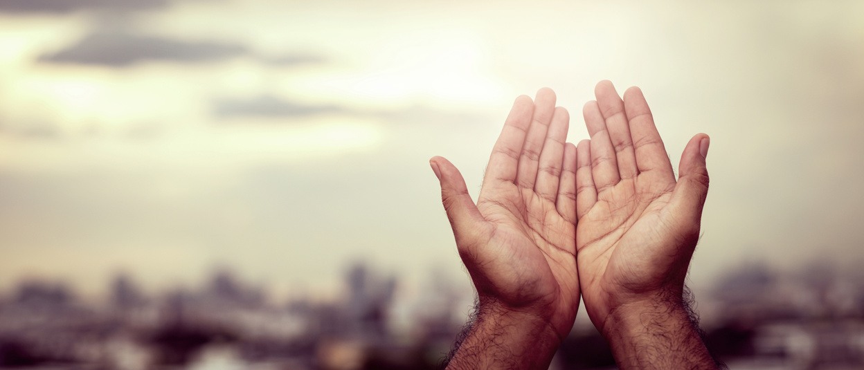 Person's Hands in Prayer